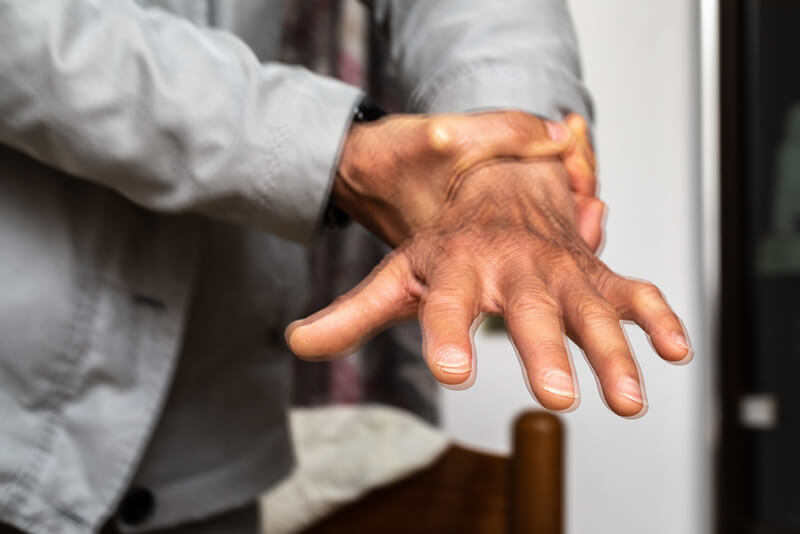 Close-up of man's shaking hands