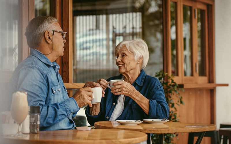 Older couple enjoying cups of coffee.jpg