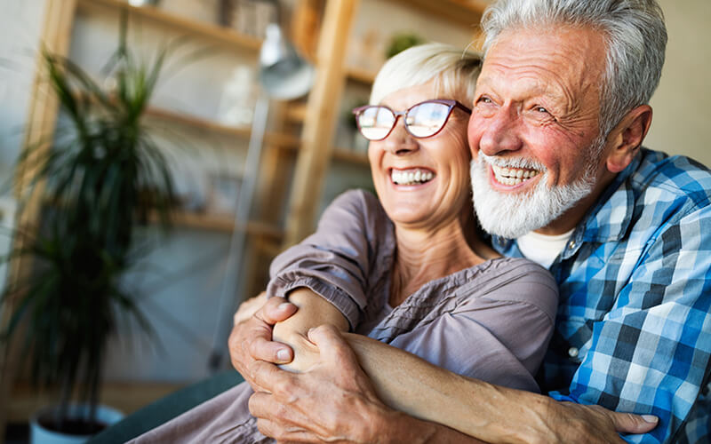 Older-couple-embracing-and-smiling.jpg